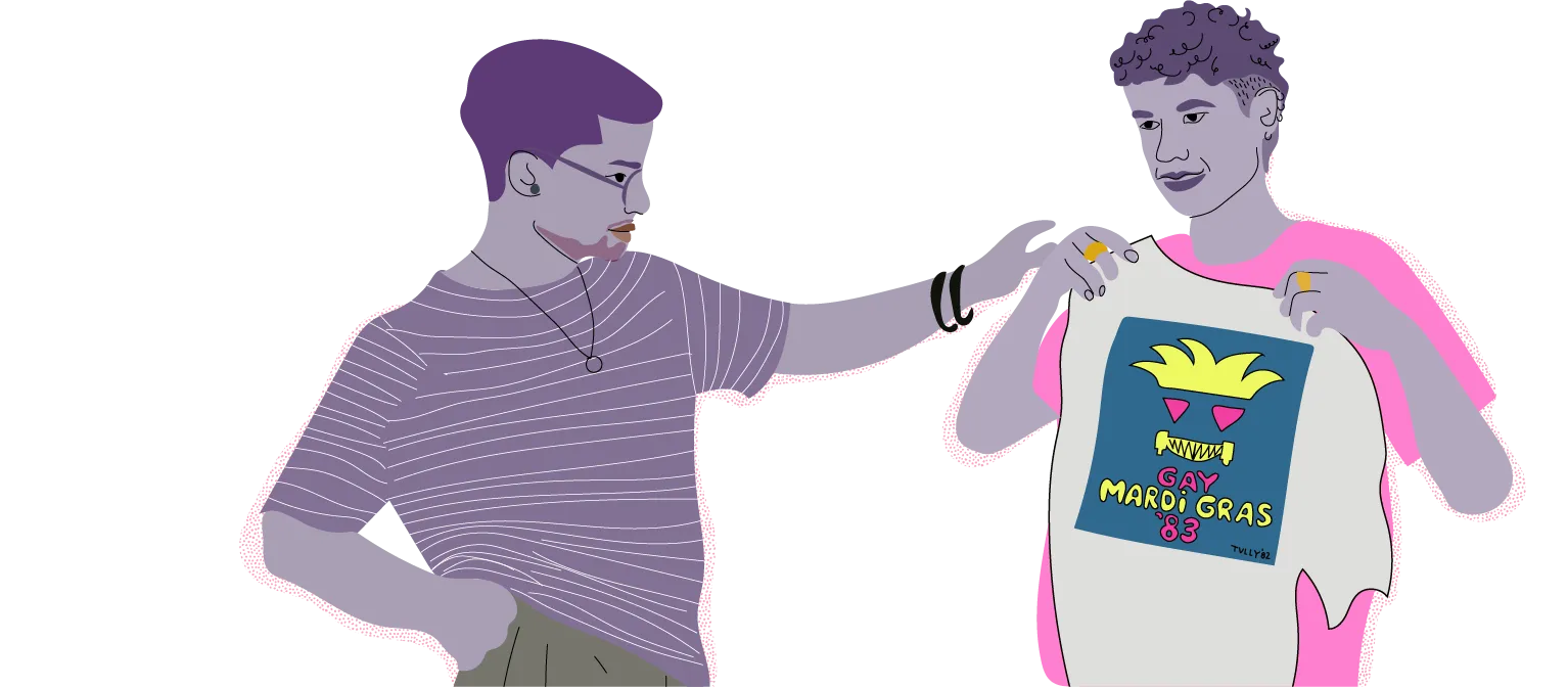 Two poeple looking at a shirt with a print that says "Gay Mardi Gras '83"